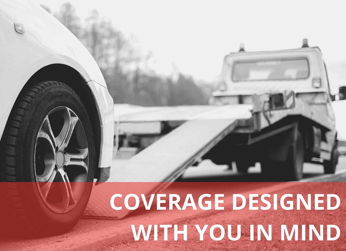 Towing and Roadside Insurance Quote - Coveratge Designed with You in Mind Text Over a Black and White Image of a Car Being Towed